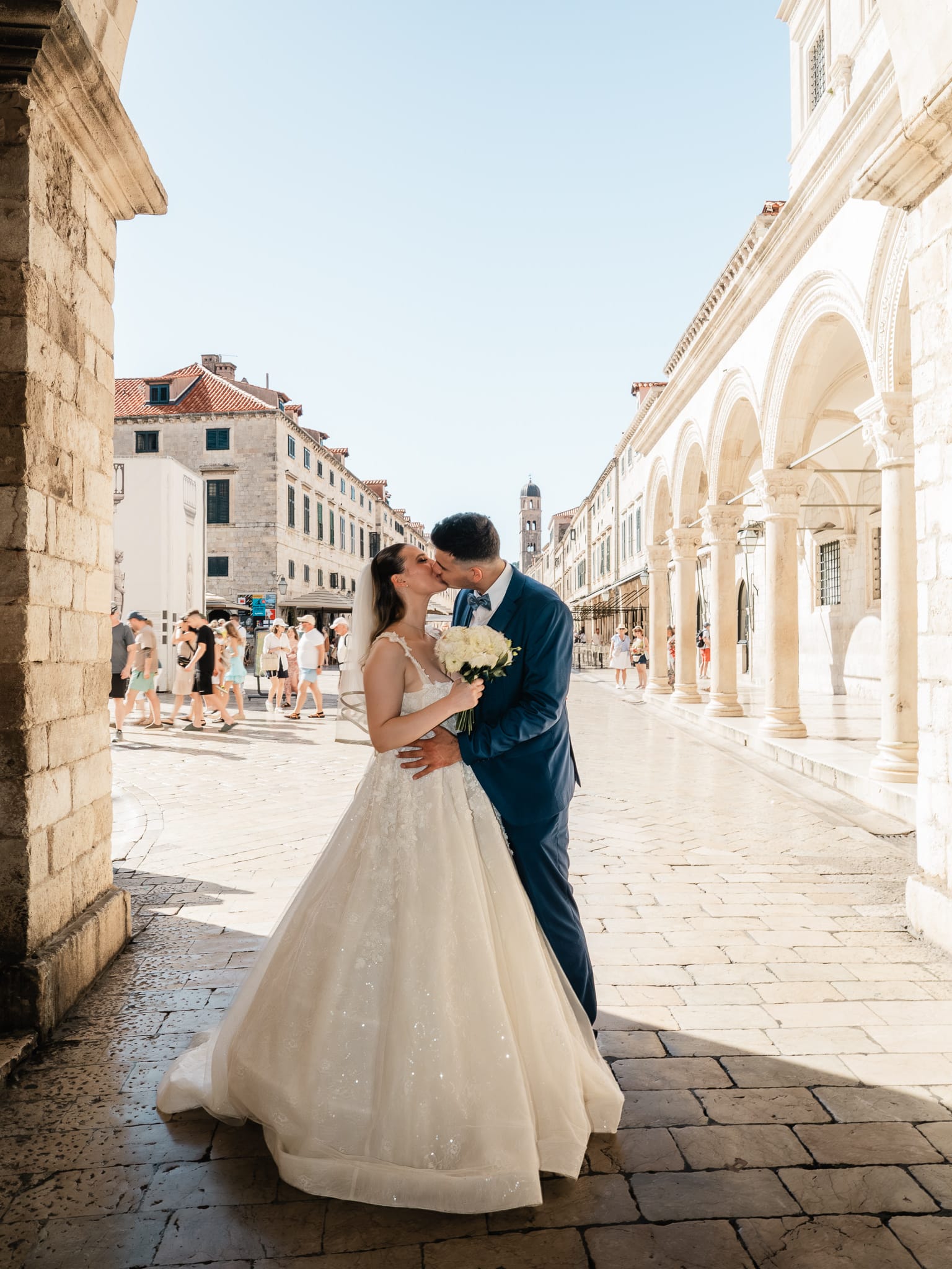 Wedding in Dubrovnik, Croatia. Couple kissing on Stradun