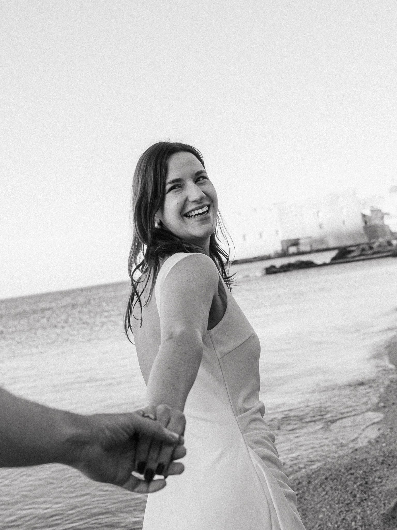 Dubrovnik Couple holding hands on the beach black and white grainy photo